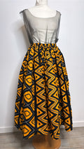 Jupe mi longue africaine en wax motifs jaune et noir plissée